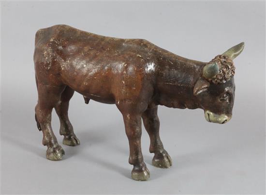 An 18th / 19th century carved and painted figure of a bullock, possibly from a Créche group, L.14.75in.